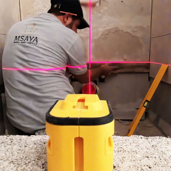 man installing porcelain tiles