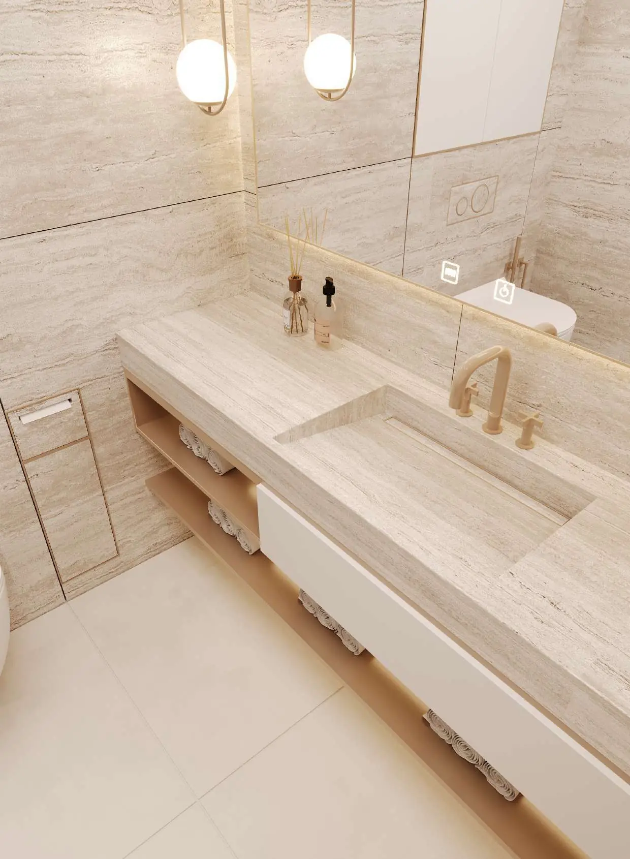 Close-up of the travertine basin and brushed-gold tap